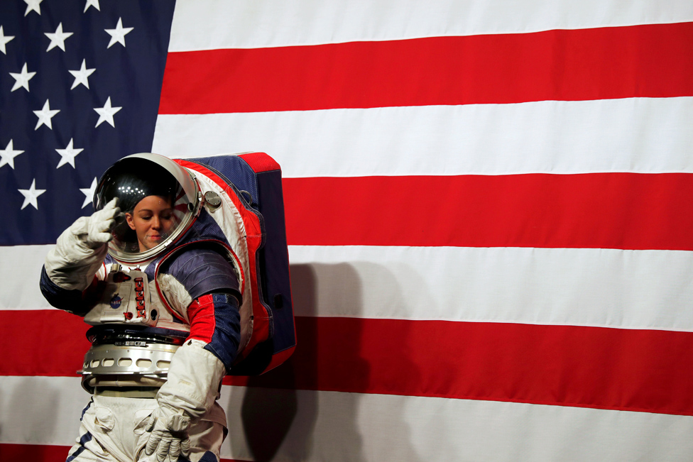 Advanced Space Suit Engineer Kristine Davis wears the xEMU prototype space suit during its presentation at NASA headquarters