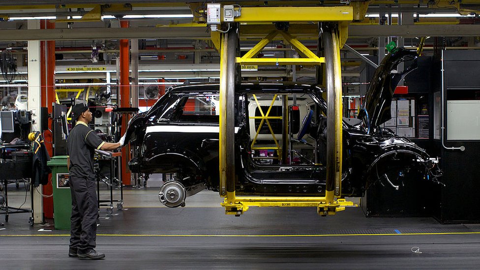 A worker at BMW's Mini factory in Oxford