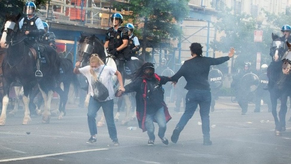 Protestors are tear gassed as the police disperse them near the White House