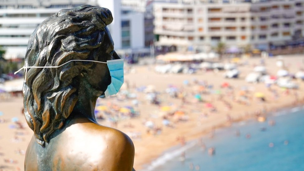 A view of Ava Gardner"s statue wearing a protective face mask in Girona, Spain