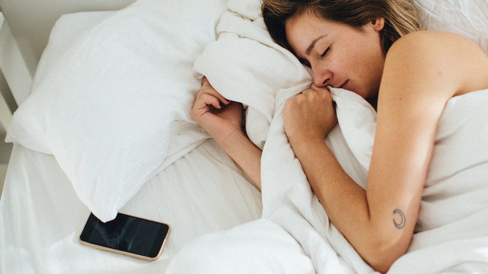 woman asleep with phone