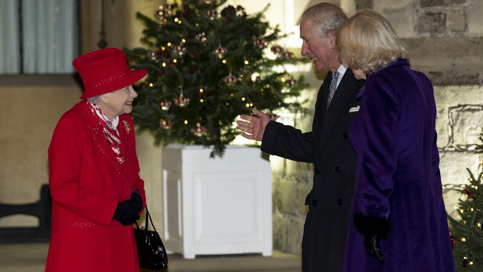 The Queen speaks to Prince Charles and Camilla