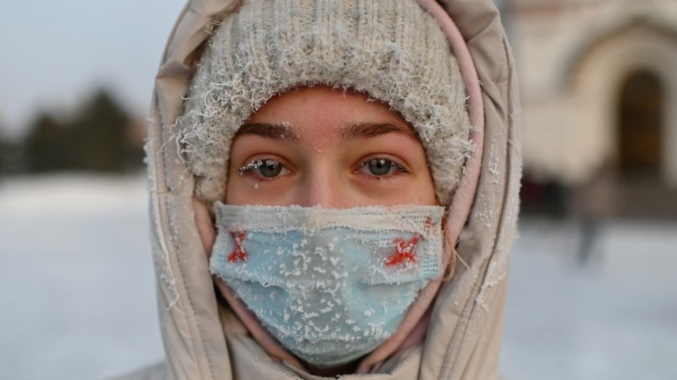 A woman attends a rally in support of jailed Russian opposition leader Alexei Navalny in Omsk,