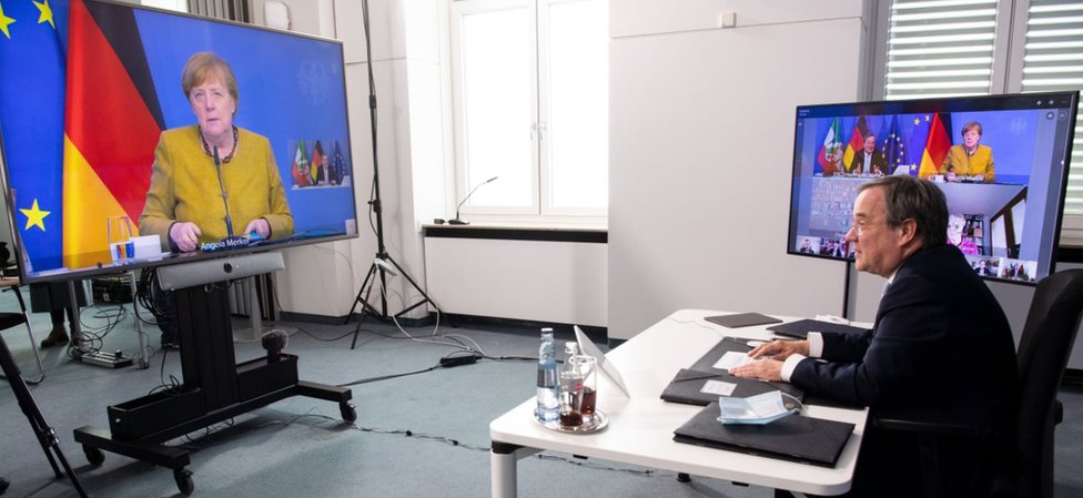 Leader of the Christian Democratic Union (CDU) and North Rhine-Westphalia's State Premier Armin Laschet sits in front of monitors in the State Chancellery in Duesseldorf to chair the meeting of the Corona Council of Experts on February 26, 2021,