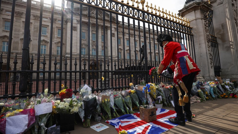 Flowers and tributes left outside Buckingham Palace