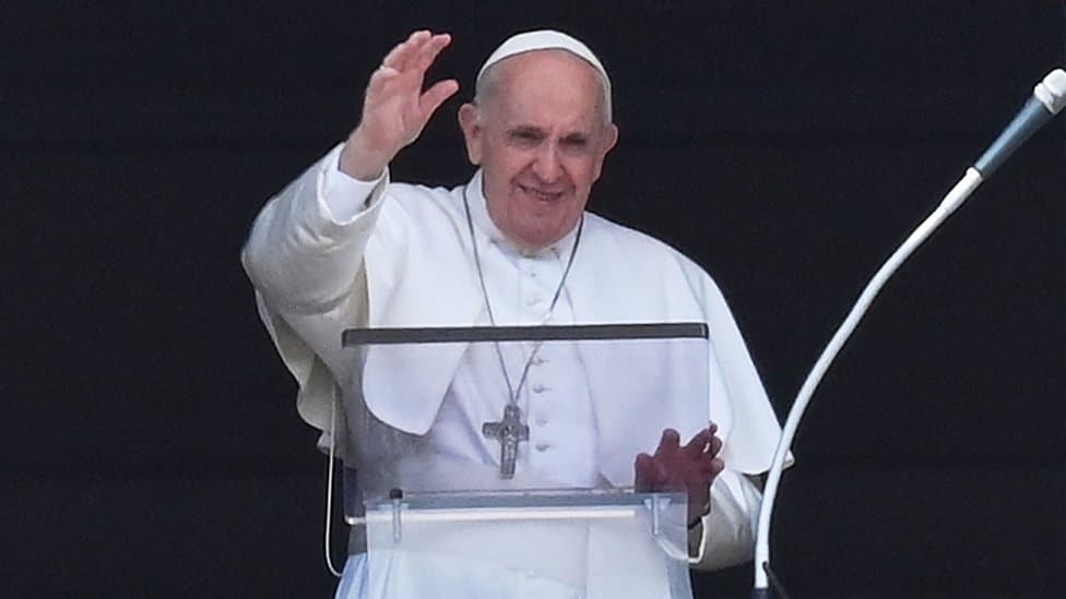 The Pope waves from the window of his study overlooking St Peter's Square at the Vatican on July 4, 2021