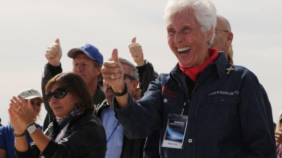 Wally Funk making a celebratory gesture