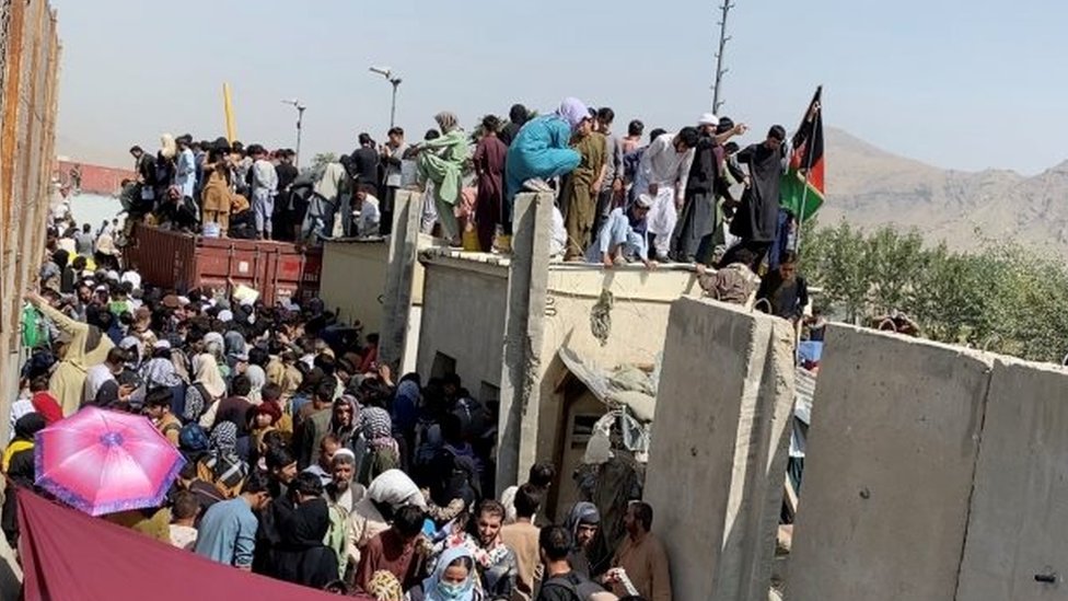 People desperate to flee remain crammed around Kabul airport