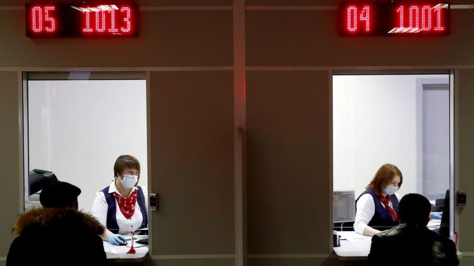 Foreign residents doing paper work at Moscow's Multifunctional migration centre in December 2019