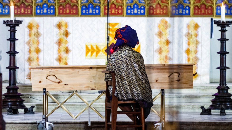 Mpho Tutu, daughter of the late Archbishop Emeritus Desmond Tutu, sits quietly on her own during his state funeral in Cape Town, South Africa, January 1, 2022.