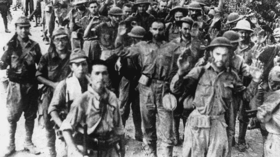 US POWs being escorted by Japanese soldiers in 1941