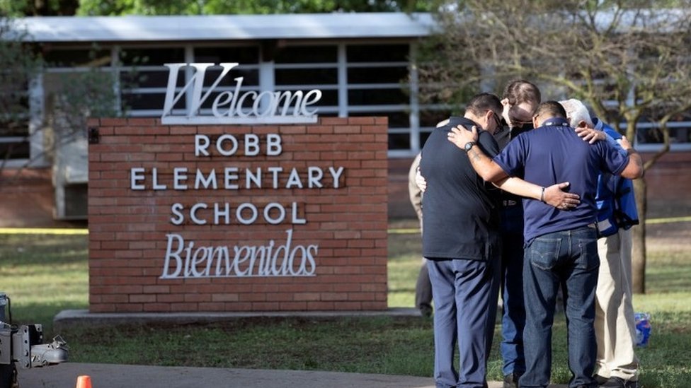 People react after a mass shooting at Robb Elementary School in Uvalde