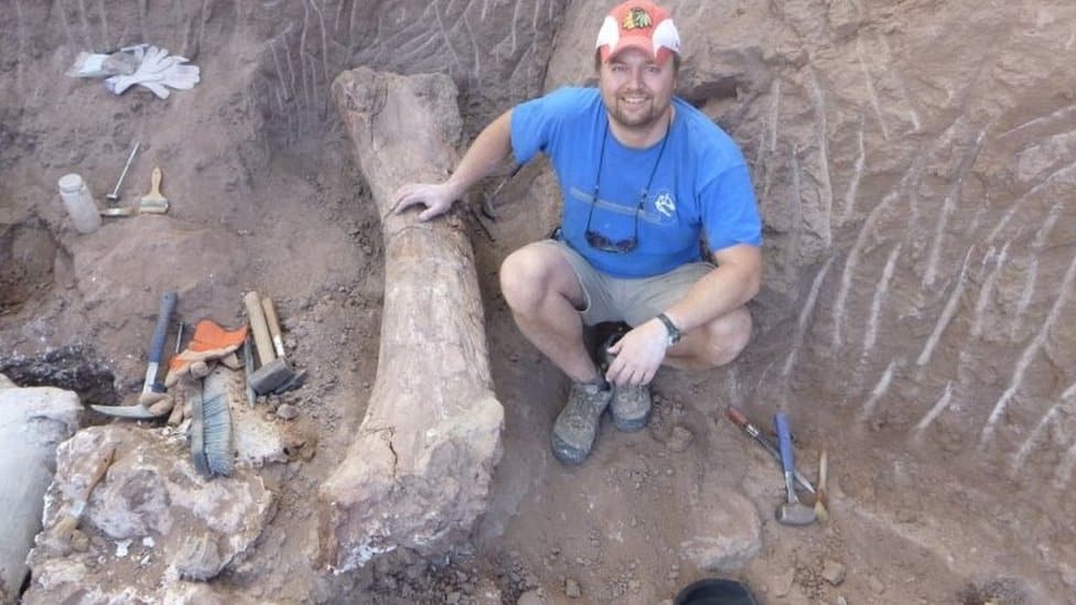 Palaeontologist Peter Makovicky studies dinosaur fossils at an excavation site in northern Patagonia, Argentina