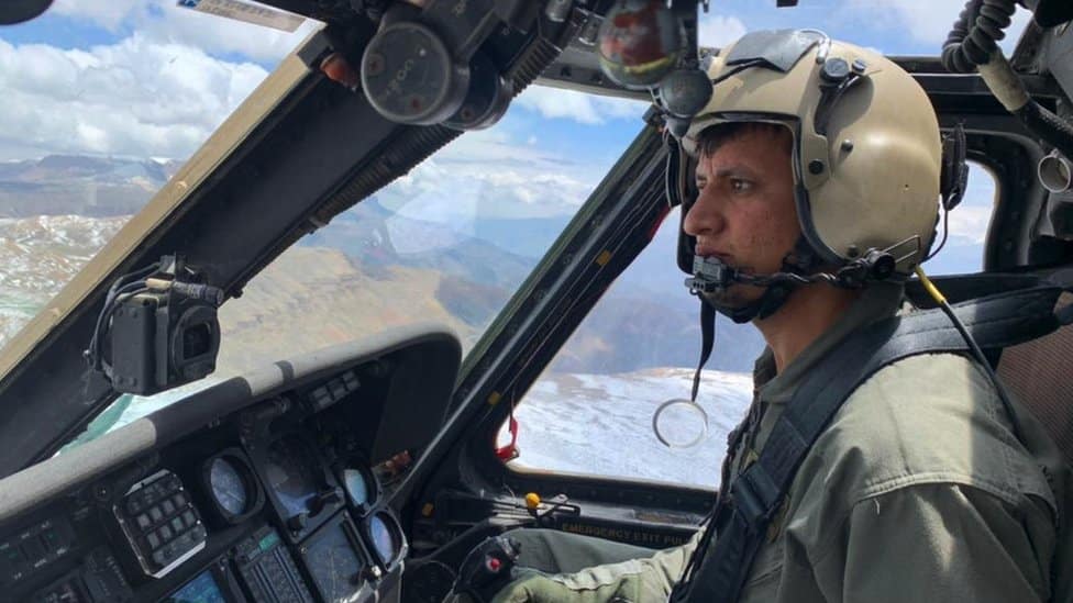 Mohammad Edris Momand flying his helicopter above Afghanistan