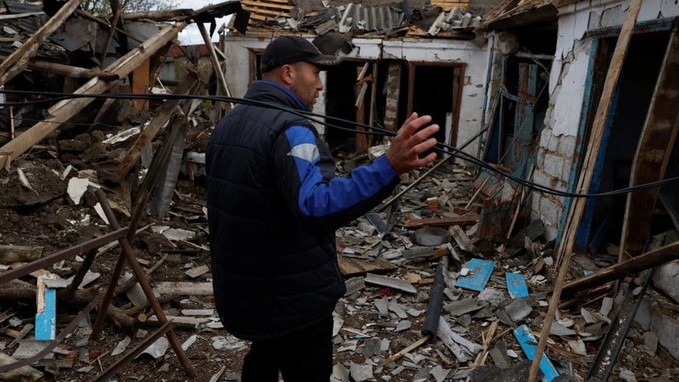 Home damaged in a missile strike near the Russian border in Kharkiv region, 21 October