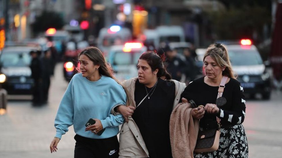 People run away as police secure the area after an explosion at Istiklal Street, Istanbul