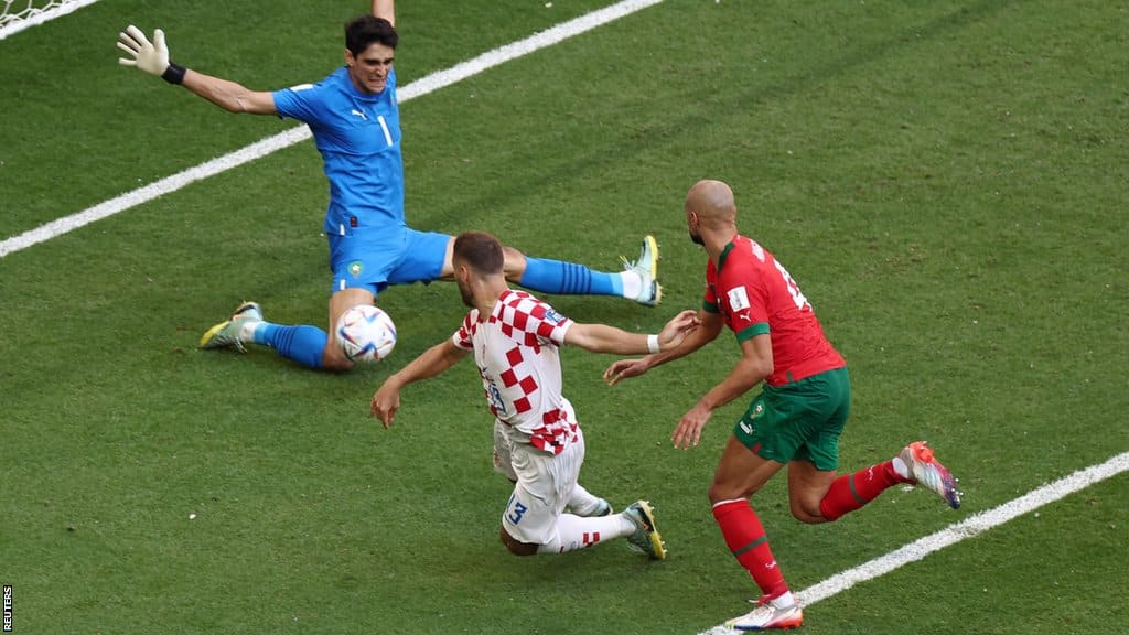 Croatia's Nikola Vlasic has a shot saved by Morocco's Yassine Bounou