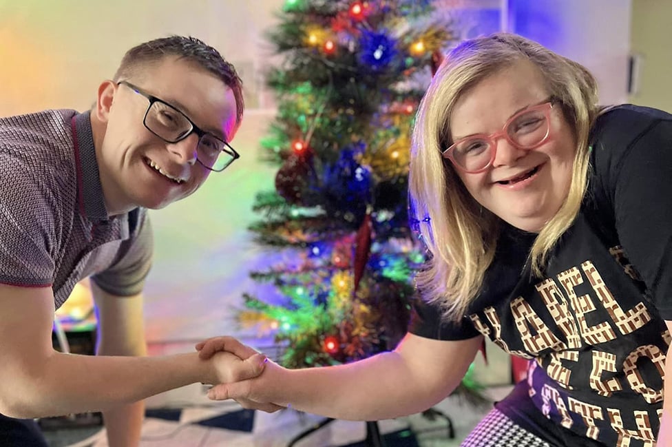 Heidi and James near a Christmas tree