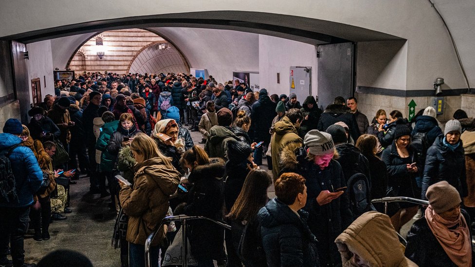 People are seen sheltering in the Kyiv metro system following a fresh wave of Russian strikes