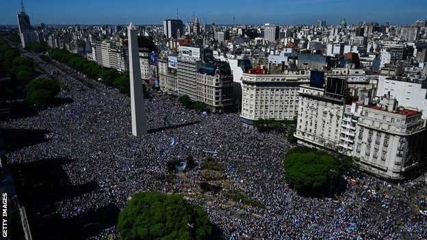 Hundreds of thousands Argentinians pack into Buenos Aires' Plaza de la República, which is where the World Cup winning-squad's bus parade will finish later on Tuesday