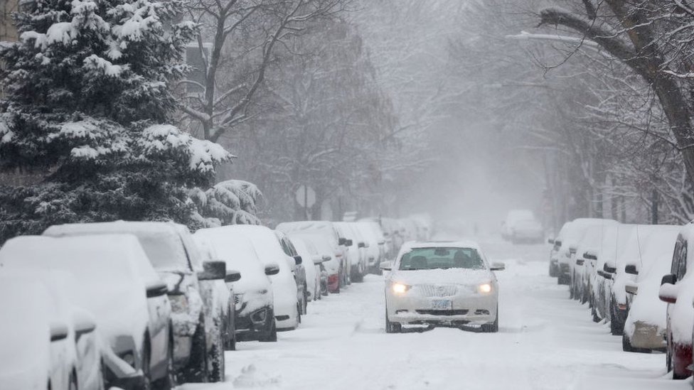 Photo of a car dumped in snow in Chicago