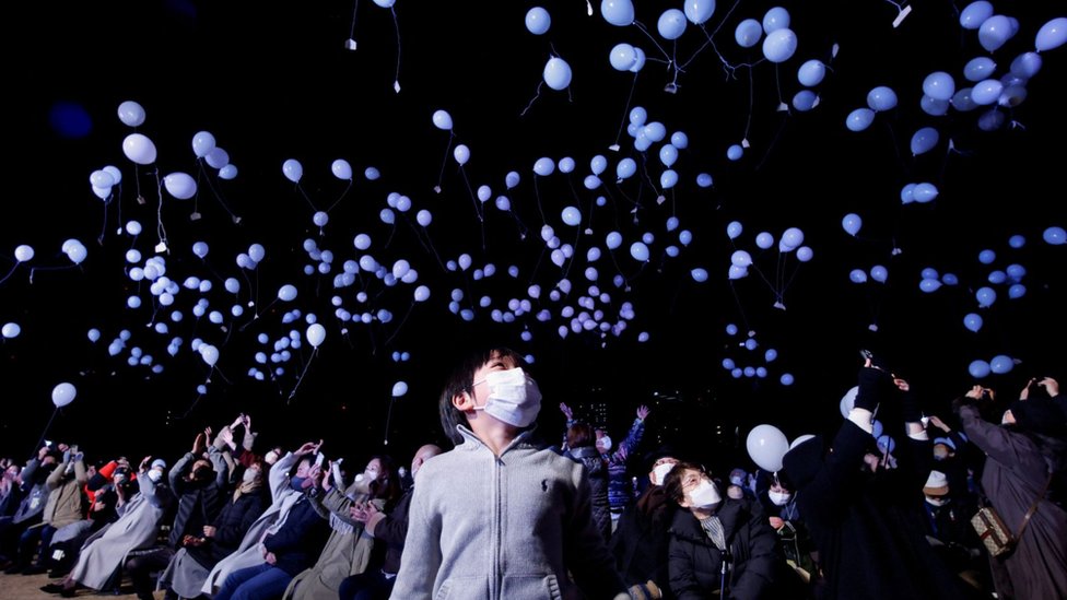 Revellers release balloons as they take part in New Year celebrations in Tokyo, Japan