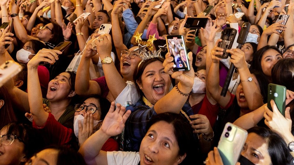 Revellers celebrate during a New Year's Eve party in Quezon City, Metro Manila, Philippines,