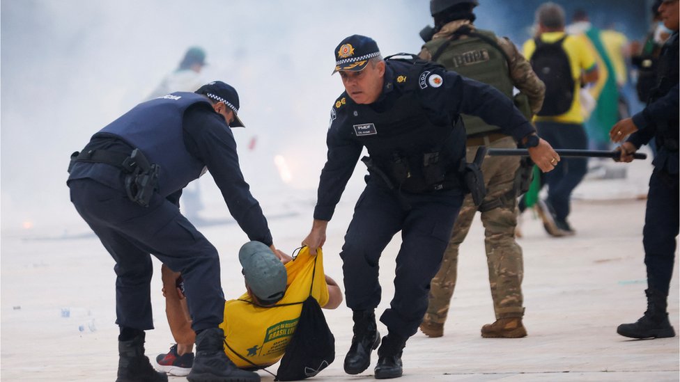 Security forces detain a supporter of Brazil's former President Jair Bolsonaro during a demonstration against President Luiz Inacio Lula da Silva, outside Brazil’s National Congress in Brasilia, Brazil, January 8, 2023