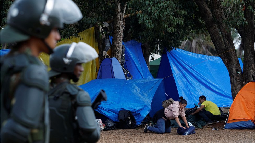 Supporters of Brazil's former President Jair Bolsonaro pack as they leave a camp outside the Army Headquarters in Brasilia, Brazil, January 9,