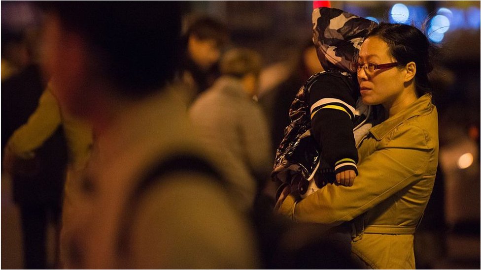 Chinese woman holding her child