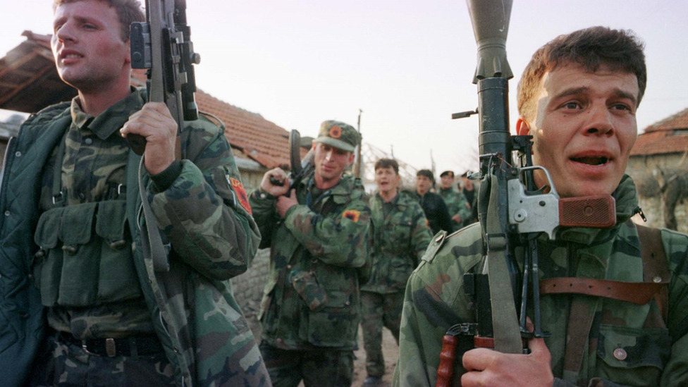 Members of the KLA returning from fighting Serb forces, May 1999