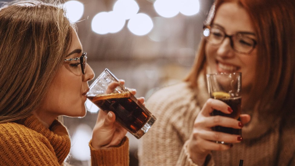 Women drinking cola