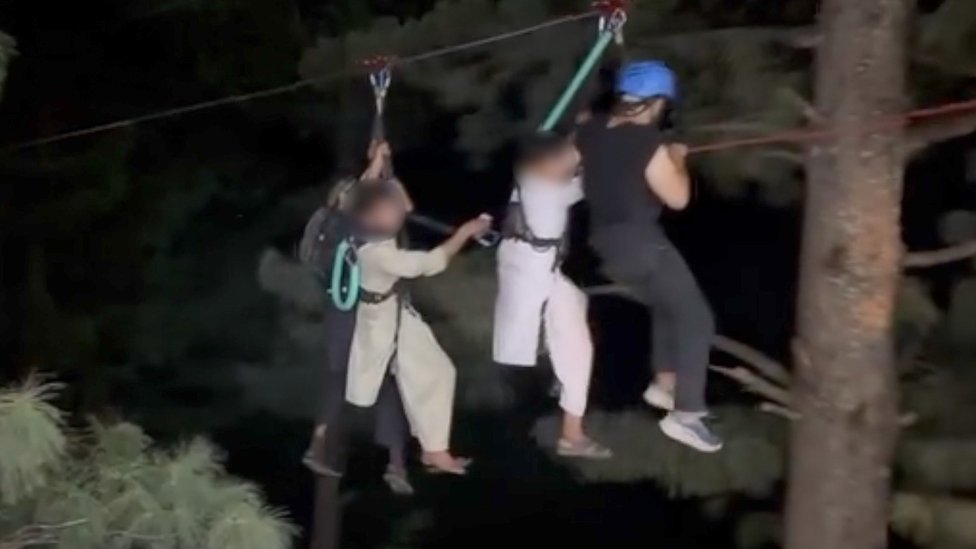 Children being ziplined to safety
