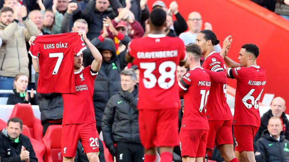 Liverpool's Diogo Jota is applauded by team-mates while holding up a shirt in support of Liverpool's Luis Diaz as he celebrates scoring their first goal