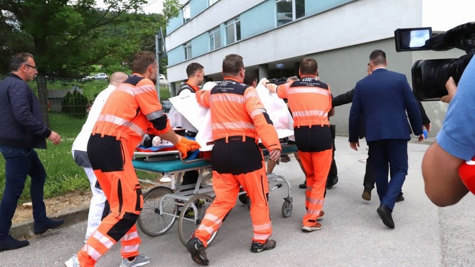 Picture taken on 15 May 2024 shows Slovak Prime Minister Robert Fico being transported by medics and his security detail to the hospital in Banska Bystrica, Slovakia where he is to be treated after he had been shot "multiple times"