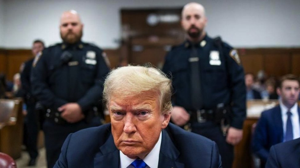 Former US President Donald Trump sits at the defendant's table inside the Manhattan Criminal Court in New York on 30 May 2024