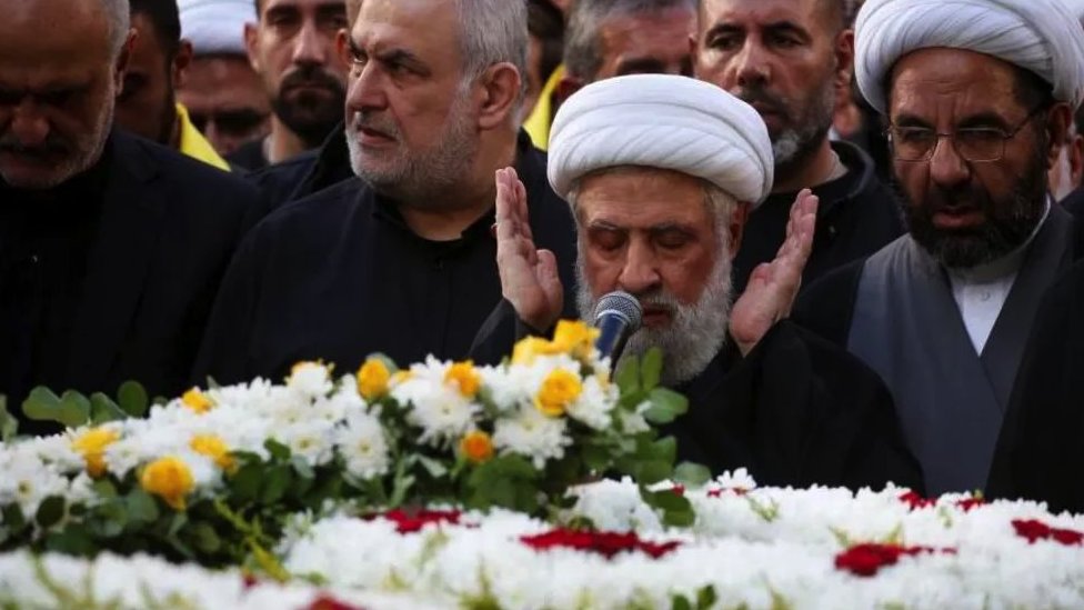 Hezbollah deputy leader Sheikh Naim Qassem leads funeral prayers for a senior commander killed by an Israeli strike