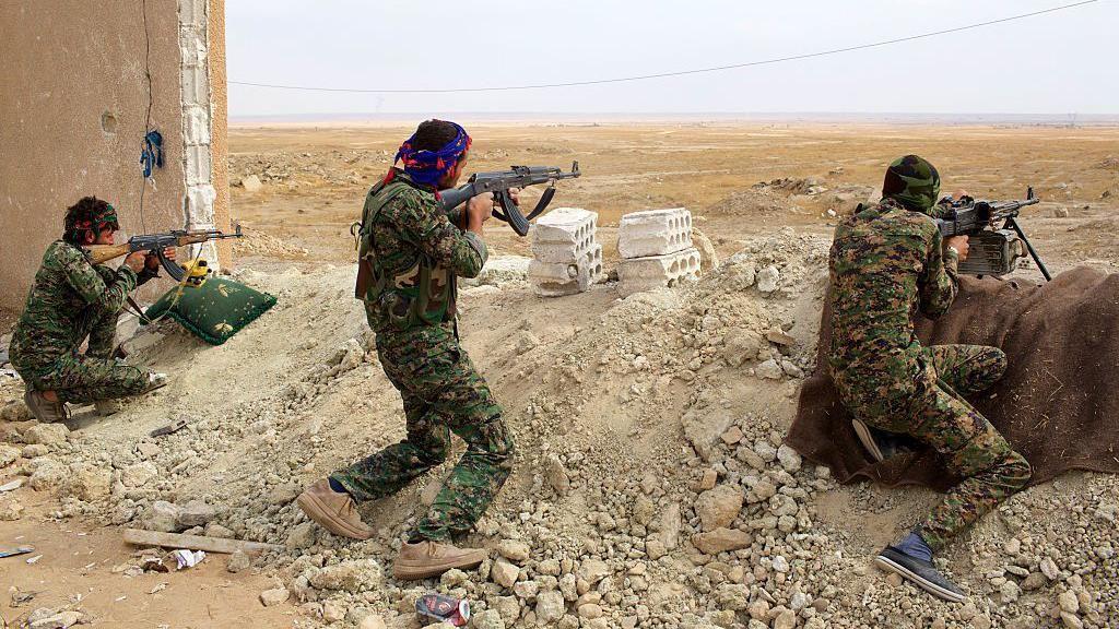 Armed soldiers of the People's Protection Units (YPG) near the front line in Kobani