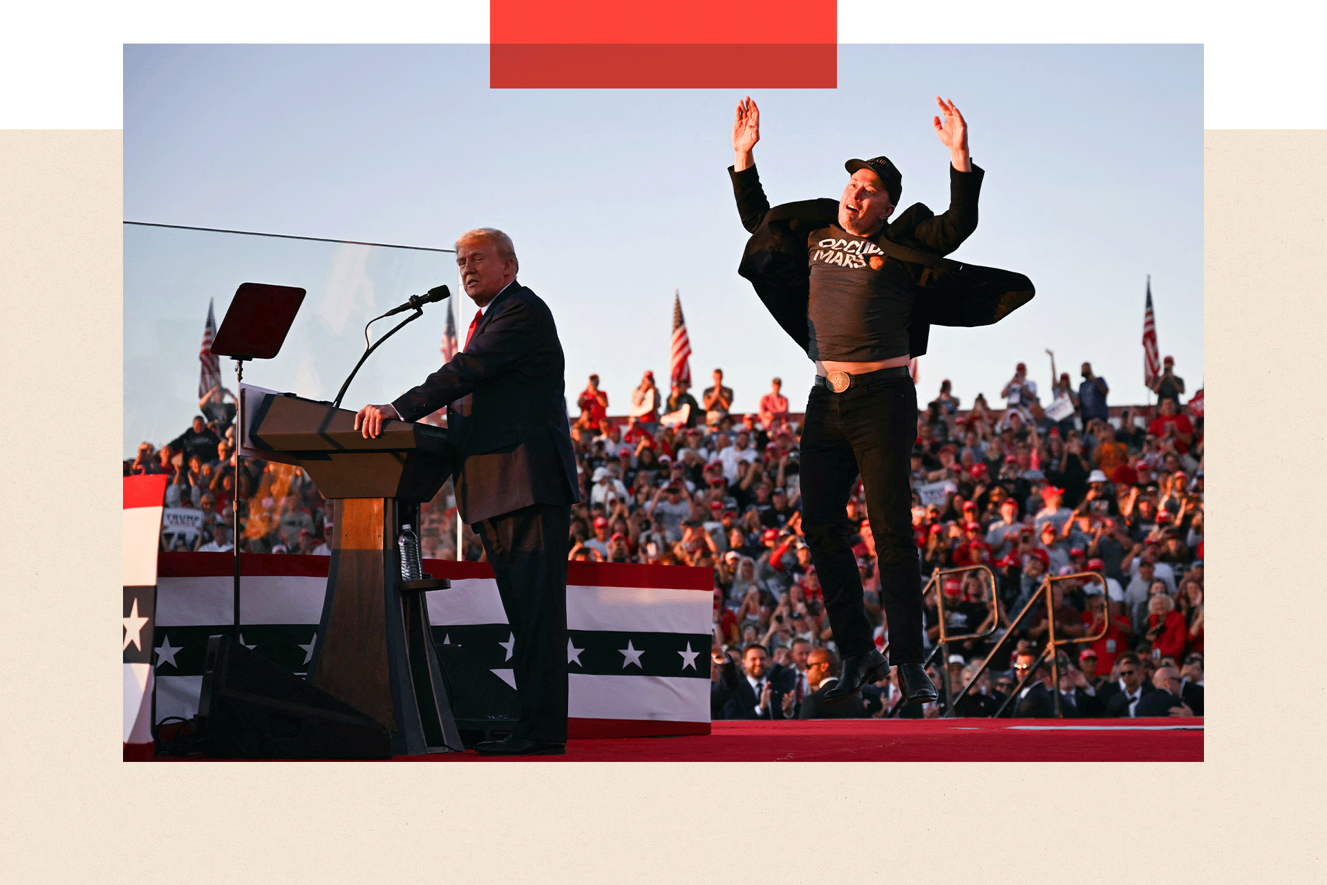 Elon Musk jumps in the air as Donald Trump gives a speech during his rally